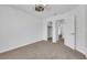 A bright, carpeted bedroom has white walls and offers access to a closet and bathroom at 124 Wynntry Dr, Henderson, NV 89074