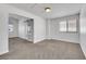 Carpeted bedroom with a sliding door and a window, providing ample space and natural light at 124 Wynntry Dr, Henderson, NV 89074