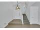 Bright foyer features tile flooring, stairs to the second level, and a front door at 124 Wynntry Dr, Henderson, NV 89074