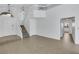 Foyer with tiled flooring, stairs to the second level, and open floorplan at 124 Wynntry Dr, Henderson, NV 89074