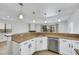 Kitchen and dining area featuring stainless steel appliances, and bar seating at 124 Wynntry Dr, Henderson, NV 89074