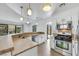 Kitchen boasts granite countertops, stainless appliances, and backyard access at 124 Wynntry Dr, Henderson, NV 89074