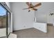 Bright living room showcasing tile floors and glass sliding doors to the backyard at 124 Wynntry Dr, Henderson, NV 89074