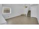 Bright living room with tile floors, and stairs to the second level at 124 Wynntry Dr, Henderson, NV 89074