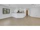 Living space boasting tile flooring, kitchen bar, and modern lighting fixtures at 124 Wynntry Dr, Henderson, NV 89074
