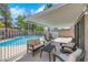 Inviting patio area with pool views, comfortable seating and shade at 124 Wynntry Dr, Henderson, NV 89074