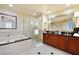 Elegant bathroom with double vanity, soaking tub, and glass-enclosed shower at 125 E Harmon Ave # 318, Las Vegas, NV 89109