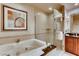 Luxurious bathroom featuring a soaking tub, glass shower, and stylish fixtures at 125 E Harmon Ave # 318, Las Vegas, NV 89109