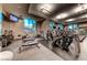 Well-equipped fitness center with treadmills, weights, and large windows at 125 E Harmon Ave # 318, Las Vegas, NV 89109