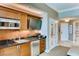 Modern kitchenette equipped with stainless steel appliances and stylish wood cabinetry at 125 E Harmon Ave # 318, Las Vegas, NV 89109