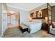 Bright main bedroom featuring a king-sized bed, modern art, and ensuite bathroom access at 125 E Harmon Ave # 318, Las Vegas, NV 89109