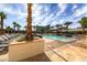 Relaxing pool area with many lounge chairs and palm trees at 125 E Harmon Ave # 318, Las Vegas, NV 89109