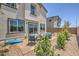 Charming backyard with stone landscaping and a cozy patio set, perfect for outdoor relaxation and entertaining at 1433 Gable Falls Pl # 95, North Las Vegas, NV 89084