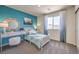 Cozy bedroom features a large window, neutral colors, and comfortable furnishings at 1433 Gable Falls Pl # 95, North Las Vegas, NV 89084