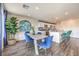 Dining room with open floor plan, views into kitchen, and luxury vinyl flooring at 1433 Gable Falls Pl # 95, North Las Vegas, NV 89084