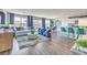 Bright, open-concept living space with luxury vinyl floors and direct access to the dining and kitchen area at 1433 Gable Falls Pl # 95, North Las Vegas, NV 89084