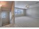Cozy upstairs bonus room with carpet, ceiling fan, and windows offering plenty of natural light at 1525 Spiced Wine Ave # 19103, Henderson, NV 89074