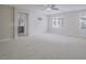 Spacious main bedroom featuring carpet, light walls, and windows offering plenty of natural light at 1525 Spiced Wine Ave # 19103, Henderson, NV 89074