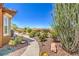 Serene backyard garden with winding pathway, cacti, and meticulous desert landscaping at 1564 Fieldbrook St, Henderson, NV 89052