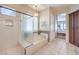 Elegant bathroom featuring a shower, a bathtub, and a view into the main bedroom at 1564 Fieldbrook St, Henderson, NV 89052