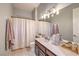Cozy bathroom with a large mirror, and vanity with decorative towels at 1564 Fieldbrook St, Henderson, NV 89052