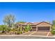 Charming single-story house with a well-manicured lawn, two-car garage, and a tile roof at 1564 Fieldbrook St, Henderson, NV 89052