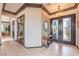 Elegant foyer with tile floors, decorative lighting, and a view into other living spaces at 1564 Fieldbrook St, Henderson, NV 89052