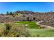 Scenic golf course view with lush green fairway, sand trap, and hillside clubhouse at 1564 Fieldbrook St, Henderson, NV 89052