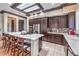 Well-appointed kitchen featuring a center island, stainless steel appliances, and tiled flooring at 1564 Fieldbrook St, Henderson, NV 89052