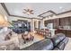 Open-concept living room with a built-in entertainment center and seamless flow into the modern kitchen at 1564 Fieldbrook St, Henderson, NV 89052