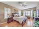 Serene main bedroom features a bay window, hardwood floors, and stylish decor at 1564 Fieldbrook St, Henderson, NV 89052