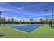 Well-maintained tennis courts with professional surface, lights, and perimeter fencing at 1564 Fieldbrook St, Henderson, NV 89052