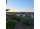 Scenic mountain and city views highlight the backyard's desert landscape at 2110 King Mesa Dr, Henderson, NV 89012