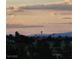 A picturesque view of the city skyline with Stratosphere tower, palm trees, and a beautiful cloudy sky at 2110 King Mesa Dr, Henderson, NV 89012