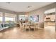 Inviting dining room featuring a modern light fixture, contemporary decor, and natural light at 2110 King Mesa Dr, Henderson, NV 89012