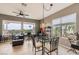 Inviting dining area with gorgeous views, a ceiling fan, and plenty of natural light at 2110 King Mesa Dr, Henderson, NV 89012