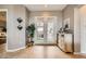 Elegant foyer with neutral wall colors, stone floors, modern decorations, and natural light at 2110 King Mesa Dr, Henderson, NV 89012