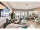 Bright living room featuring neutral-toned walls, contemporary furniture, and large windows with scenic views at 2110 King Mesa Dr, Henderson, NV 89012