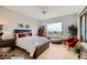 Bedroom with neutral tones, a ceiling fan, plenty of natural light, and a comfortable bed at 2110 King Mesa Dr, Henderson, NV 89012