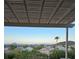 Outdoor patio with covered pergola, serene mountain views, and glimpses of the neighborhood at 2110 King Mesa Dr, Henderson, NV 89012