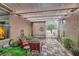 Inviting outdoor patio with a pergola, stone pavers, comfortable seating, and stylish decor at 2110 King Mesa Dr, Henderson, NV 89012