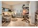Cozy sitting room features a comfortable arm chair, stylish bookcase, and bright lighting at 2110 King Mesa Dr, Henderson, NV 89012