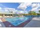 Outdoor swimming pool with clear blue water, lounge chairs and a pool house with shaded picnic tables at 2110 King Mesa Dr, Henderson, NV 89012