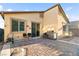 The cozy backyard has a paver patio with a built-in grill and ample seating space at 2128 Delmar Farms Ct, Laughlin, NV 89029
