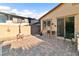 This backyard features a paver patio with seating, offering a perfect blend of relaxation at 2128 Delmar Farms Ct, Laughlin, NV 89029
