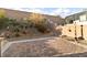 Landscaped backyard with rock features, perfect for enjoying the outdoors at 2128 Delmar Farms Ct, Laughlin, NV 89029