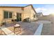 This backyard has a paver patio with a built-in grill and ample seating space at 2128 Delmar Farms Ct, Laughlin, NV 89029