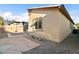 This backyard offers easy maintenance with rock landscaping and a stone slab patio at 2128 Delmar Farms Ct, Laughlin, NV 89029