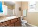 Well-lit bathroom featuring granite counters, wood cabinets, and tiled floors at 2128 Delmar Farms Ct, Laughlin, NV 89029