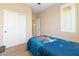 Comfortable bedroom featuring neutral walls, plush carpet, closet and a window with shutter at 2128 Delmar Farms Ct, Laughlin, NV 89029